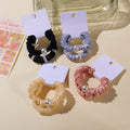 Set di 2 elastici per capelli con perle