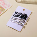 Fermagli a becco d'anatra ondulati neri e argentati - 4 pezzi