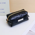 Trousse per il trucco con cuscino a motivo pelle di serpente - Nero